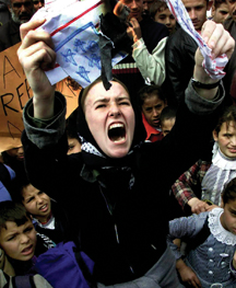 Rachel Corrie burns a mock U.S. flag during a rally in the southern Gaza town of Rafah in February 2003. photo/ap/khalil hamra